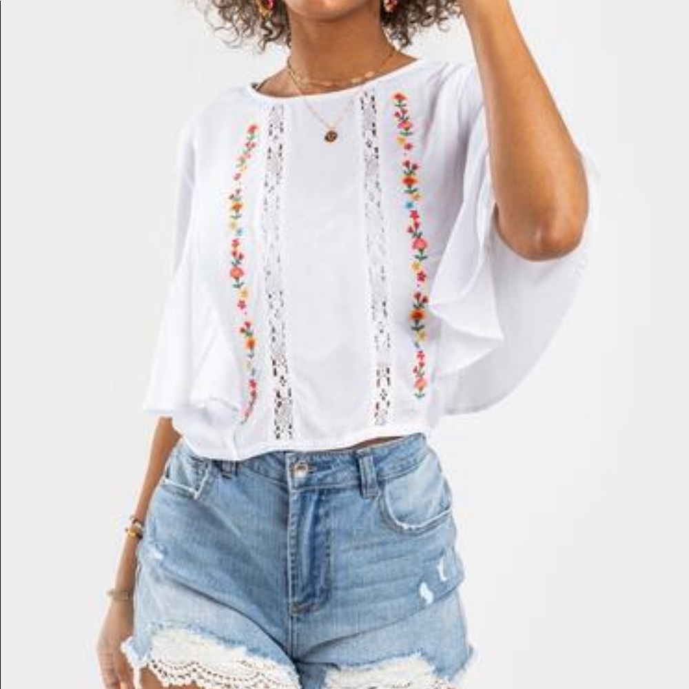 Francesca’s brand white Embroidered blouse